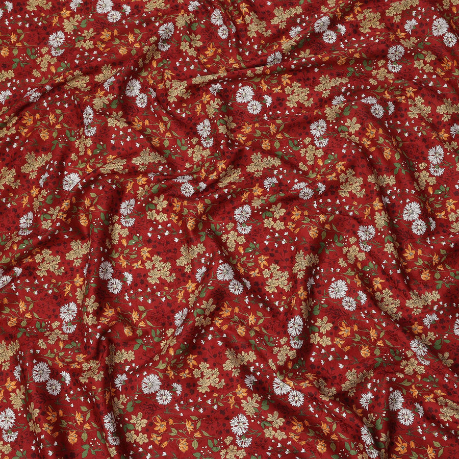 Deep red cotton lawn printed Fabric with white daisies, marigold blooms and sage green botanical vines, 110 Cms Width, India-D25286