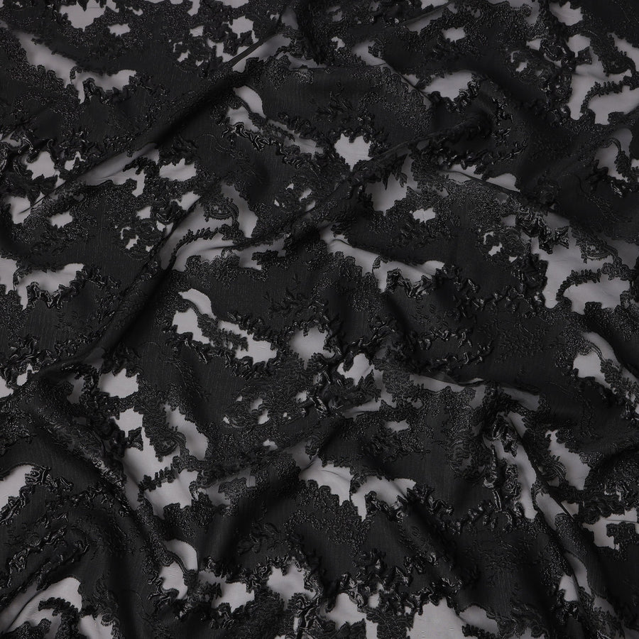 Black synthetic Brocade Fabric with tonal abstract cutwork jacquard and charcoal grey accents, 140 Cms Width, Turkey-D25280