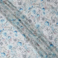 Grey and Aqua Blue Floral Printed Viscose Georgette Fabric with Soft Pastel Blossoms and Leafy Detailing, 110 Cms Width, Made in India-D25871