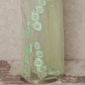 قماش تول نايلون أبيض عاجي مطرز بزخارف نباتية هندسية بلون النعناع وخرز فضي متعرج، عرض 140 سم، صنع في الهند - D23504