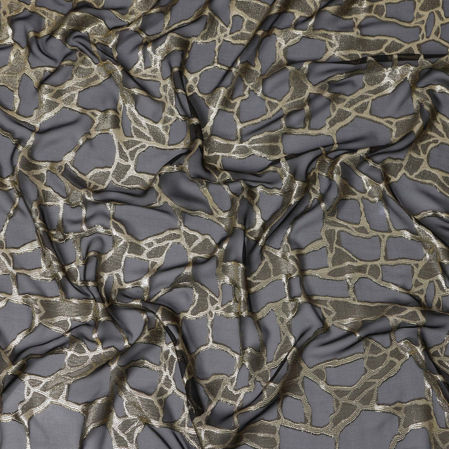 قماش شيفون حرير فرنسي أسود بتصميم لوريكس ذهبي معدني، عرض 110 سم - D21667