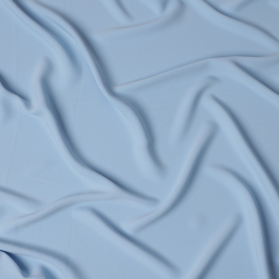 قماش كريب صناعي سادة قابل للتمدد بلون أزرق سماوي - عرض 140 سم - صنع في إندونيسيا - D22113