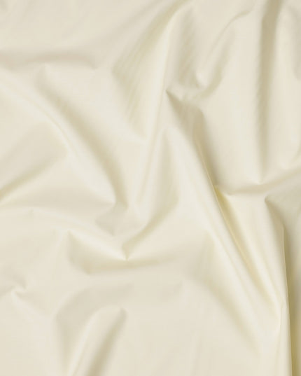 قماش قمصان قطني سويسري من البوليستر بلون أصفر عاجي سادة، عرض 150 سم، صنع في سويسرا - D22911