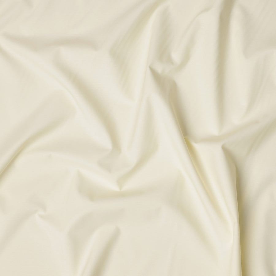 قماش قمصان قطني سويسري من البوليستر بلون أصفر عاجي سادة، عرض 150 سم، صنع في سويسرا - D22911