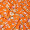 Bright Orange Base Lush Garden Floral Print Silk Crepe Fabric with Multicolor Blossoms and Leafy Accents, Soft Drape, 110 cms Width, Made in India-D23360