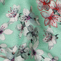 قماش فيسكوز مطبوع عليه زهور باللون الأخضر النعناعي ومطرز بخيوط حمراء، 110 سم، الهند - D23841