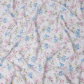 White Cotton Lawn Fabric with Multicolor Floral Print in Blue, Pink, and Yellow Hues with Green Leaf Detailing, Soft Lightweight Texture, 110 Cms Width, Made in India-D22543