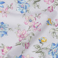 White Cotton Lawn Fabric with Multicolor Floral Print in Blue, Pink, and Yellow Hues with Green Leaf Detailing, Soft Lightweight Texture, 110 Cms Width, Made in India-D22543