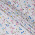 White Cotton Lawn Fabric with Multicolor Floral Print in Blue, Pink, and Yellow Hues with Green Leaf Detailing, Soft Lightweight Texture, 110 Cms Width, Made in India-D22543