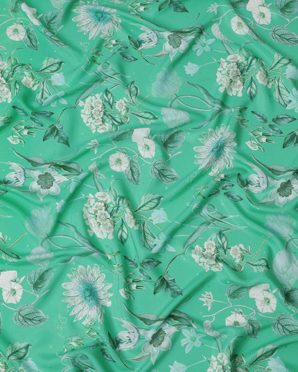 قماش حرير ساتان إيطالي فاخر بقاعدة خضراء نعناعية مع طبعة زهور نباتية باللونين الأبيض والأزرق المخضر، عرض 140 سم، صنع في إيطاليا - D22994