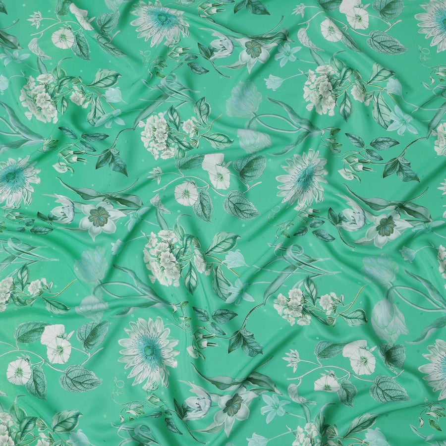 قماش حرير ساتان إيطالي فاخر بقاعدة خضراء نعناعية مع طبعة زهور نباتية باللونين الأبيض والأزرق المخضر، عرض 140 سم، صنع في إيطاليا - D22994