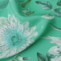 قماش حرير ساتان إيطالي فاخر بقاعدة خضراء نعناعية مع طبعة زهور نباتية باللونين الأبيض والأزرق المخضر، عرض 140 سم، صنع في إيطاليا - D22994
