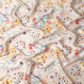 Ivory Pure Silk Satin Fabric with Delicate Multicolor Floral Pattern - Luxurious Italian Fabric, 140cm Wide-D18700