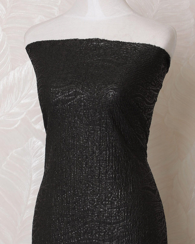 Black synthetic stretchable brocade fabric with same gold metallic shine in self design-D15983