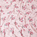 Lemonade pink synthetic crepe fabric with print in black, dark pink and green in floral design-D15654