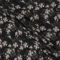 Black synthetic crepe fabric with white, light green and red digital prints in floral design-D15771 Regal Fabrics