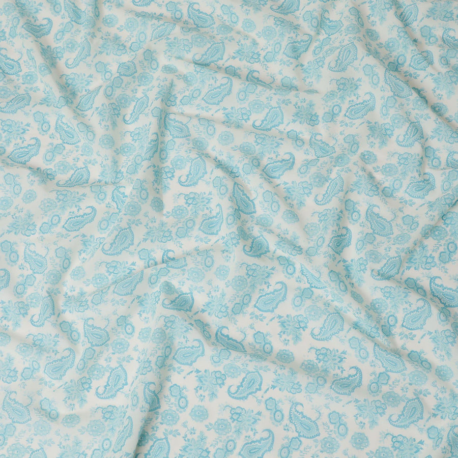 Off white cotton voile fabric with baby blue print in paisley design-D16417