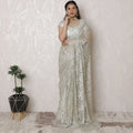Luxurious Silver Metallic Lace Saree, French-Designed, 110cm Width, Stone Embellishments, 5.5m Length â€“ Blouse Piece Not Included
-D17866 Regal Fabrics