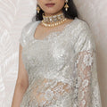 Luxurious Silver Metallic Lace Saree, French-Designed, 110cm Width, Stone Embellishments, 5.5m Length â€“ Blouse Piece Not Included
-D17866 Regal Fabrics