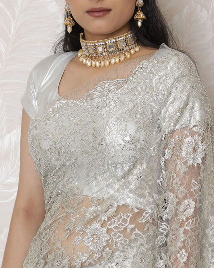 Luxurious Silver Metallic Lace Saree, French-Designed, 110cm Width, Stone Embellishments, 5.5m Length â€“ Blouse Piece Not Included
-D17866 Regal Fabrics