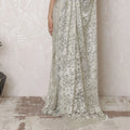 Luxurious Silver Metallic Lace Saree, French-Designed, 110cm Width, Stone Embellishments, 5.5m Length â€“ Blouse Piece Not Included
-D17866 Regal Fabrics