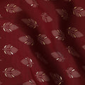 Maroon Synthetic blended cotton fabric with brick red and gold foil print in floral design-D16738