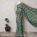 Exquisite Teal Georgette Saree with Unstitched Blouse-D17509