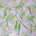Light lilac premium pure silk crepe fabric with same tone jacquard having lime green print and gold metallic lurex in floral design-D15719