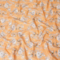 Cantaloupe orange uragiri cotton voile fabric with same tone jacquard having white, black and pale brown print in floral design-D14315