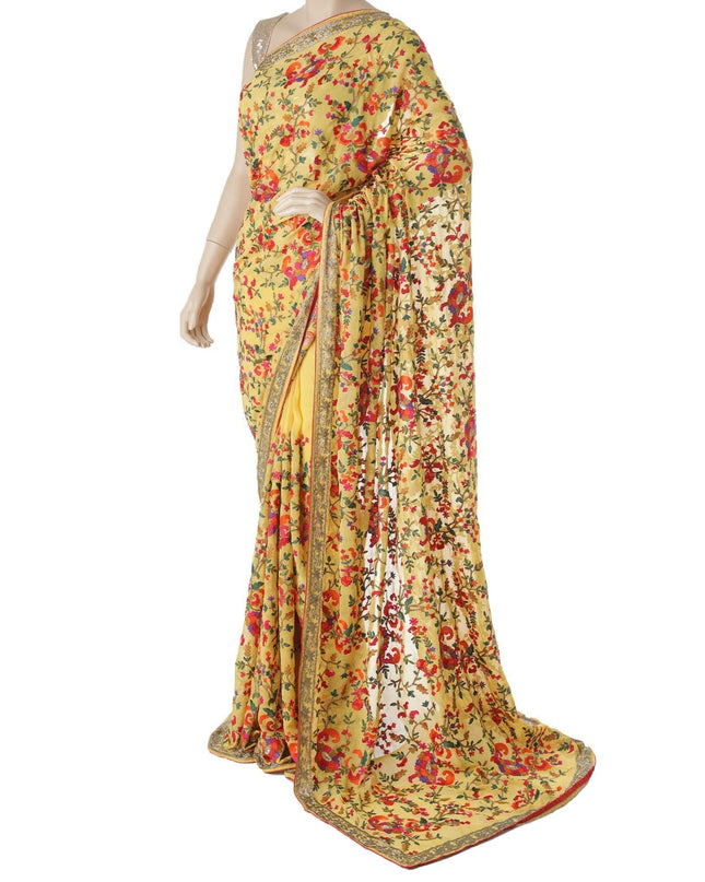 Light mustard yellow blended synthetic chiffon saree with multicolor embroidery in fancy design having multicolor bead work