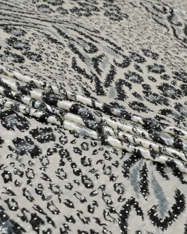 Daisy white Rayon velvet fabric with black, pewter grey print having metallic silver studs in abstract design Regal Fabrics