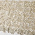 Honeysuckle beige nylon tulle fabric with floral embroidery and fancy border in floral design