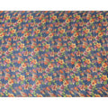 Petrol blue tussar silk fabric with olive green, tangerine orange, blonde yellow and light plum print in floral design-D6140 Regal Fabrics