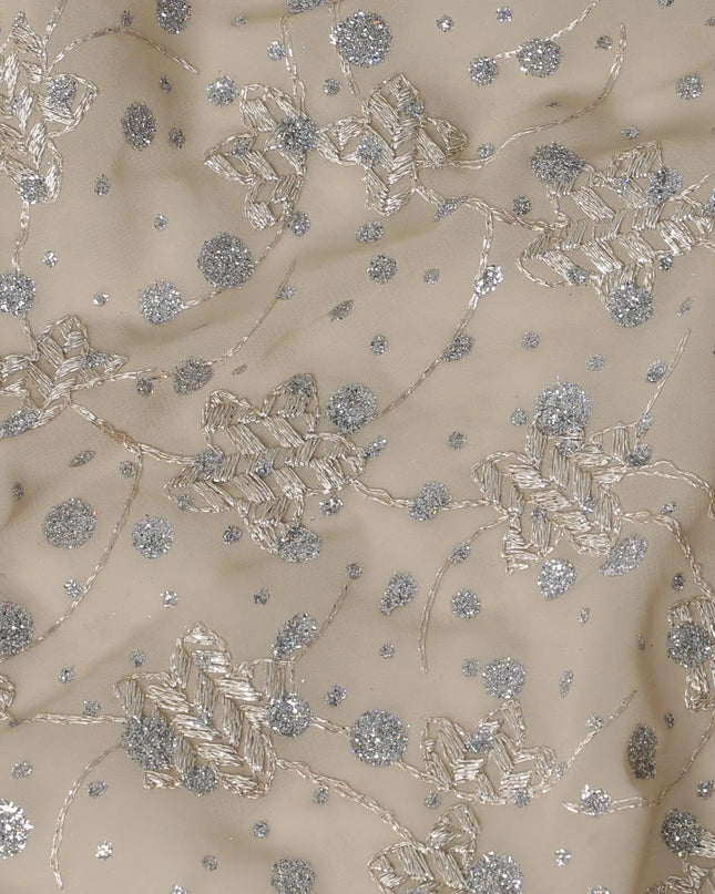 Parmesan Beige fabric with beige embroidery and silver glitters in floral design Regal Fabrics