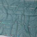 Teal blue guipure lace fabric with cut work in abstract design