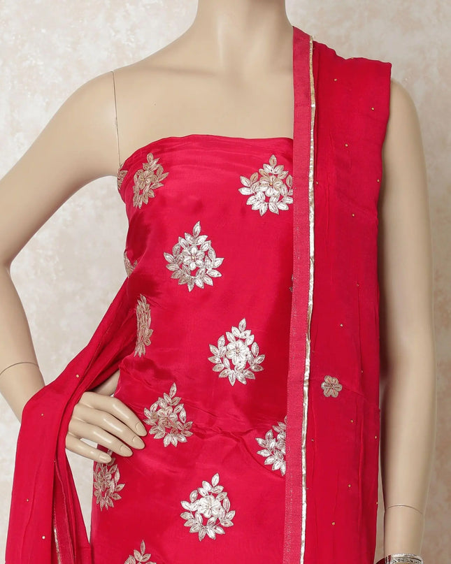 Ruby pink silk kameez with gold gota work embroidery and stone work in floral design. Ruby pink plain salwar having same tone chiffon dupatta with gold embroidery and stone work-D12688 Regal Fabrics