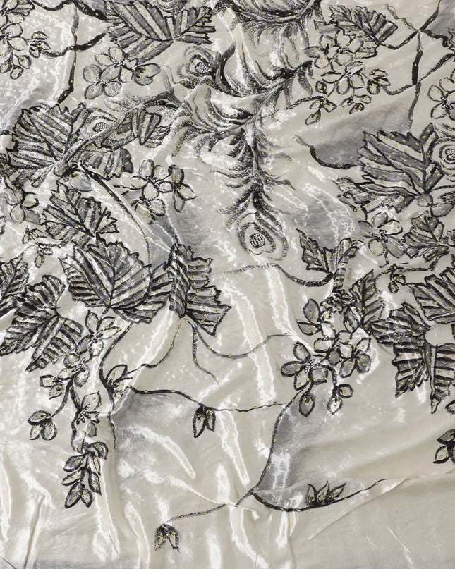 Macaroon Beige Rayon velvet fabric with charcoal grey print having green and silver stonework in leaf design Regal Fabrics