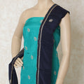 Turquoise blue silk kameez with gold embroidery having sequin work and bead work in floral design. Navy blue plain salwar having same tone chiffon dupatta with gold bead work-D12697 Regal Fabrics