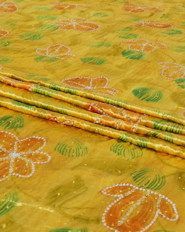 قماش مخمل رايون أصفر من Bumblebee مع طباعة ذهبية صفراء وخضراء مع أحجار صفراء وبيضاء بتصميم الأزهار