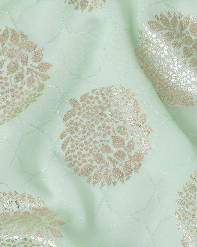 Mint green synthetic georgette fabric with same tone embroidery having gold foil printed in floral design-D12228 Regal Fabrics