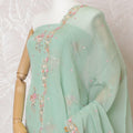 Mint green silk crepe kameez with gold embroidery, sequins and bead work in floral design. Mint green plain salwar with same tone flat chiffon dupatta having gold embroidery and mirror work-D15528