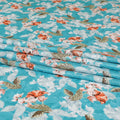 Sky blue uragiri cotton voile fabric with same tone jacquard having off white, peach and sage green print in floral design-D7339