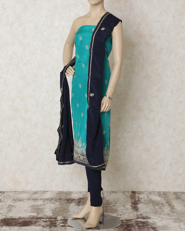 Turquoise blue silk kameez with gold embroidery having sequin work and bead work in floral design. Navy blue plain salwar having same tone chiffon dupatta with gold bead work-D12697 Regal Fabrics