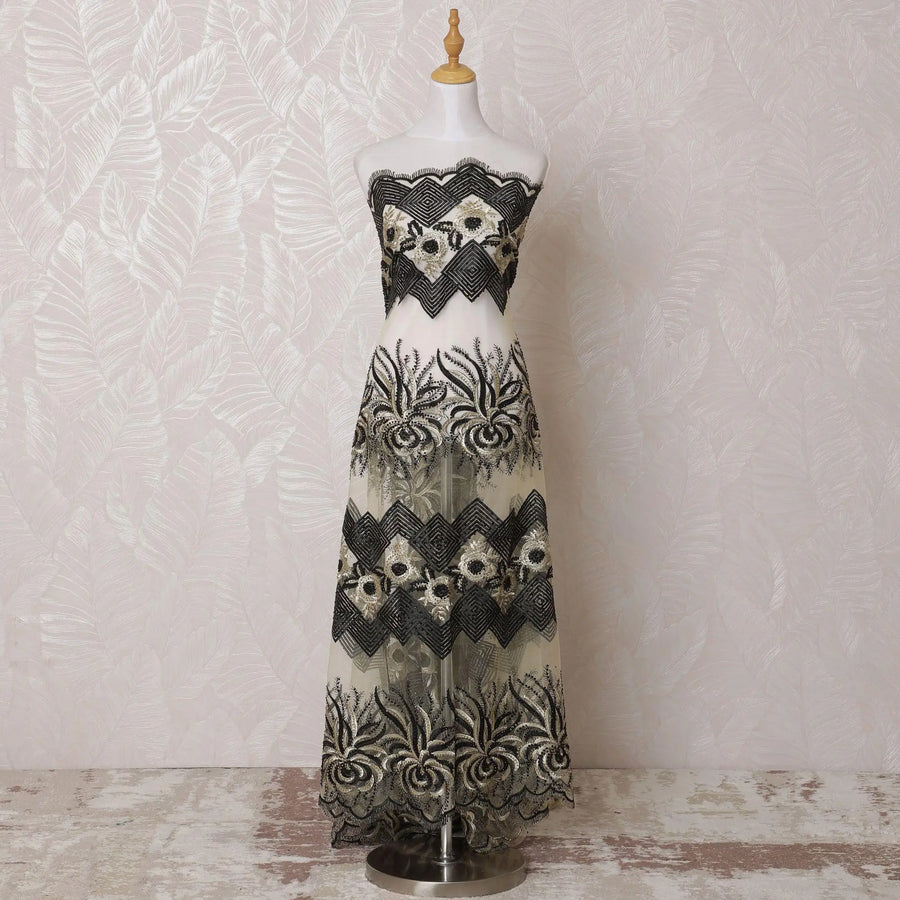 Gold nylon tulle fabric with same tone, black embroidery having stone work in fancy design-D14709 Regal Fabrics