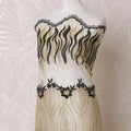 Gold nylon tulle fabric with same tone, black embroidery having stone work in fancy design-D14710 Regal Fabrics