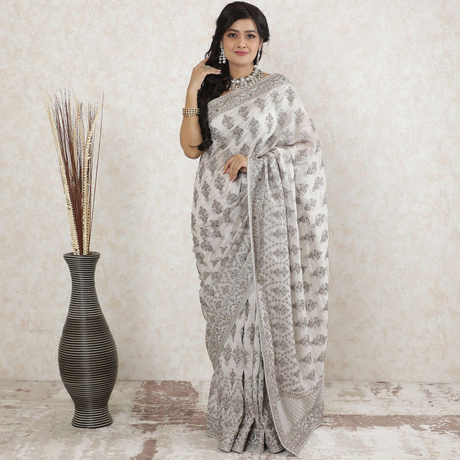 Pearl grey tussar silk saree with same tone, brown and forest green embroidery having stone work in floral design-D13490