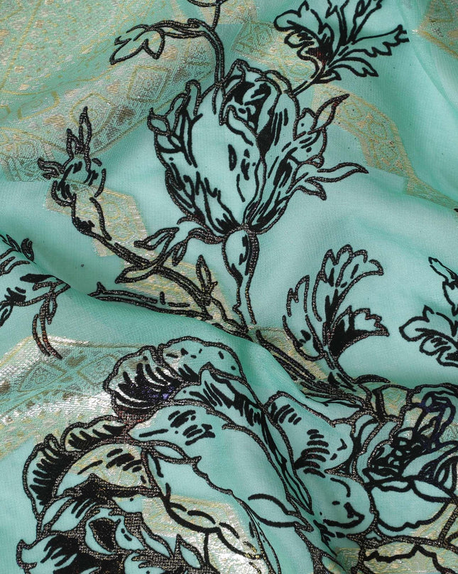 Light teal premium pure silk chiffon fabric with black flock having glitter and gold metallic lurex in floral design-D13723