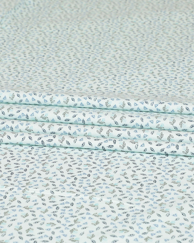 Light vista green blended cotton shirting fabric with blue and black print in leaf design-D9633