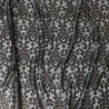 Black nylon tulle fabric with gold embroidery in fancy design