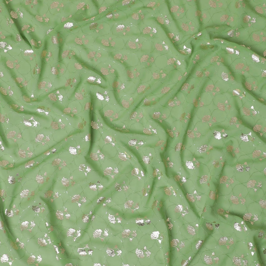 Sage green synthetic georgette fabric with same tone embroidery having gold foil print in floral design-D12030 Regal Fabrics